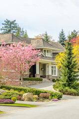 Two story luxury house with beautiful summer  landscape in Vancouver, Canada, North America. Day time on June 2024.