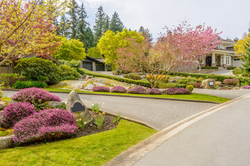 Two story luxury house with beautiful summer  landscape in Vancouver, Canada, North America. Day time on June 2024.