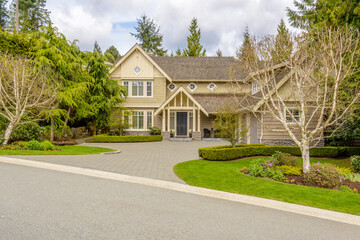 Two story luxury house with beautiful summer  landscape in Vancouver, Canada, North America. Day time on June 2024.