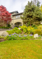 Two story luxury house with beautiful summer  landscape in Vancouver, Canada, North America. Day time on June 2024.