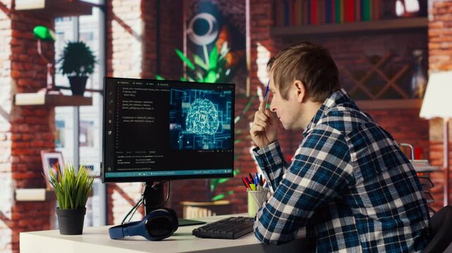 AI software developer at computer waiting for code to finish compiling, rubbing forehead with pen, feeling bored. Impatient man waits for artificial intelligence scripts to finish compiling, camera B