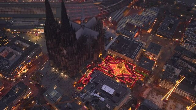 Christmas market near to Cologne Cathedral, evening Weihnachtsmarkt, Koelner Dom in Cologne, Germany, Aerial Winter Shot