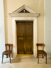 Korcula, Croatia - June 30, 2024: Saint Michael Church, door to private parts of building