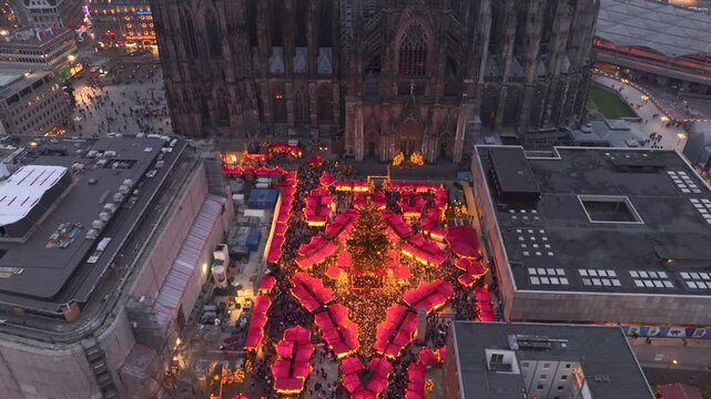 Christmas market near to Cologne Cathedral, evening Weihnachtsmarkt, Koelner Dom in Cologne, Germany, Aerial Winter Shot