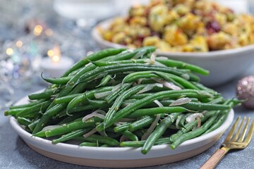 Side dish Haricot verts or French green beans with caramelized shallots, horizontal