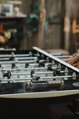 Close-Up of Foosball Table at Rustic Outdoor Wedding: Elegant Recreation and Entertainment Setup in a Relaxed Garden Party Atmosphere