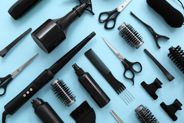 Different hairdresser's accessories on blue background
