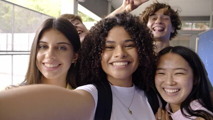 Selfie Perspective of Diverse Teen Students Having Fun in High School