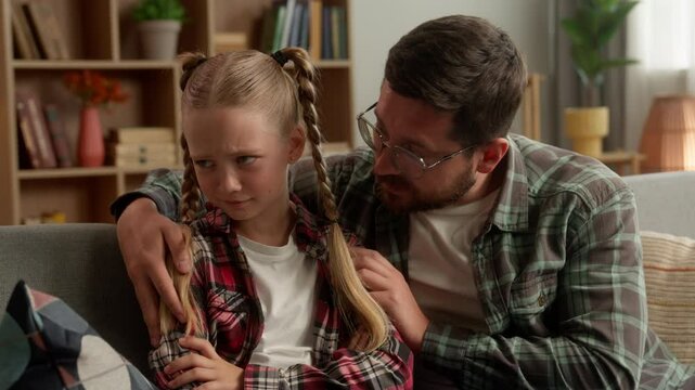 Family argument offended Caucasian child little kid girl avoid ignoring guilty man dad male guy asking forgiveness sorry at home caring parent father apology touch daughter stress difficulty conflict