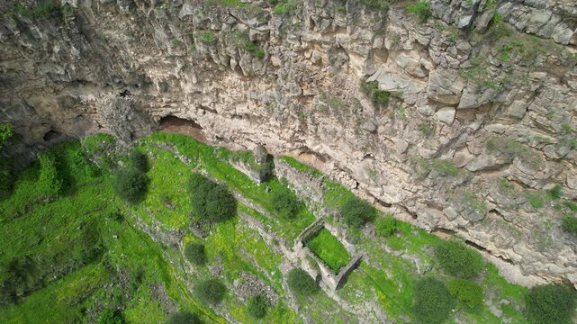 Rising up aerial shot of remains of Horomayri monastery on a spring day. Odzun village, Armenia.