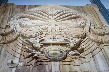 teak wood carving of a stylized collage on a CNC machine, a headpiece for a ship, marine animals