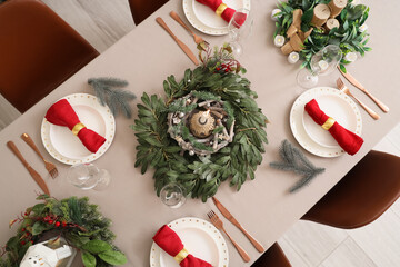 Beautiful table setting with Christmas decor. Top view