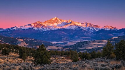 Majestic Sunrise Illuminates Snowy Mountain Range