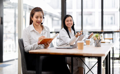 Asian call center team, customer service, telesales wearing headset or headphone talking with customer in the office. Customer Service Representative, Service, Call Center, 