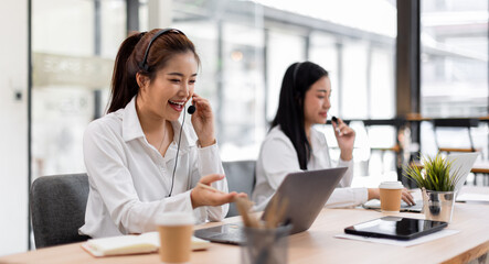 Asian call center team, customer service, telesales wearing headset or headphone talking with customer in the office. Customer Service Representative, Service, Call Center, 