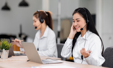 Asian call center team, customer service, telesales wearing headset or headphone talking with customer in the office. Customer Service Representative, Service, Call Center, 