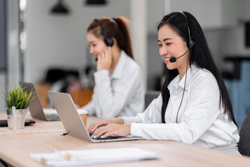 Asian call center team, customer service, telesales wearing headset or headphone talking with customer in the office. Customer Service Representative, Service, Call Center, 