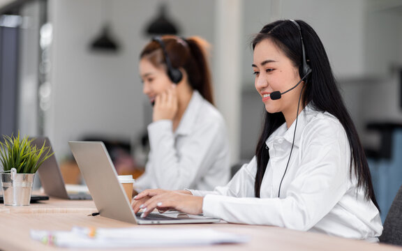 Asian call center team, customer service, telesales wearing headset or headphone talking with customer in the office. Customer Service Representative, Service, Call Center, 
