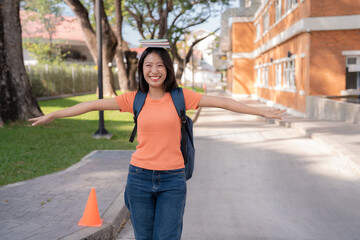 Cheerful female student walking on campus with books balanced on her head, smiling and showcasing a positive attitude towards education and good balance