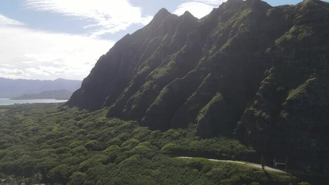 Scenic drone B-roll aerial overview of Kaaawa Beach, Mokolii Island, Oahu Hawaii
