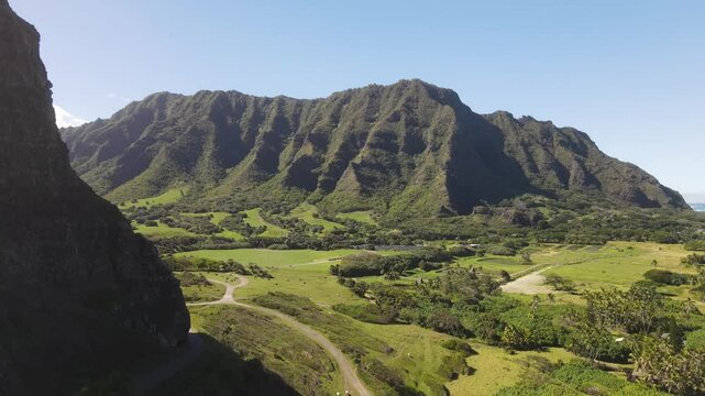 Scenic drone B-roll aerial overview of Kaaawa Beach, Mokolii Island, Oahu Hawaii