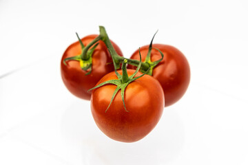 Tomatos isolated. Tomatoes on white background. Three tomatoes side view