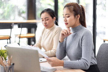 Business Documents, Auditor two businesswomen checking searching document legal prepare paperwork or report for analysis TAX time,accountant Documents data contract partner deal in workplace office