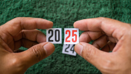 Happy New Year 2025. Prepare your New Year's life planning resolutions. Transition of the New Year's numbers from 2024 to 2025