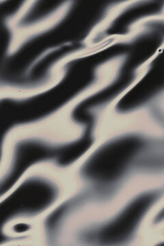 Abstract black-and-white fluid waves or ripples