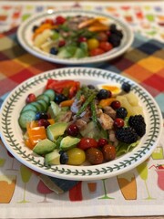 Fresh vegetable salad with a vibrant mix of greens, cherry tomatoes, cucumbers, and bell peppers. Crisp, colorful, and packed with vitamins, this salad makes a healthy, delicious meal or side.

