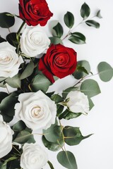 Fototapeta premium Elegant Arrangement of Red and White Roses with Green Leaves