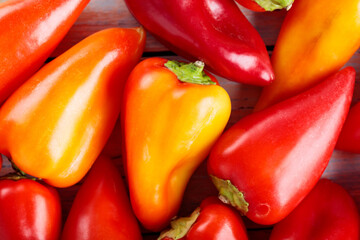 Ripe Red and Orange Bell Peppers Capsicum on Wooden Boards for Vegan Recipes