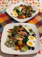 Chicken salad. Chicken Caesar Salad. Caesar Salad with grilled chicken and croutons. Grilled chicken breast and fresh green salad isolated on white plate

