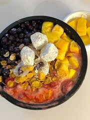 A refreshing bowl of bingsu, topped with fluffy shaved ice, vibrant fruits, and sweet toppings. Perfect for summer treats, this Korean dessert captures the essence of indulgence and delight.
