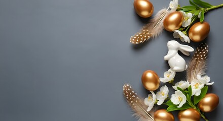 Easter table decorations. Happy Easter concept with golden easter eggs, feathers, ceramic bunny and spring flowers. Easter background with copy space. Flat lay