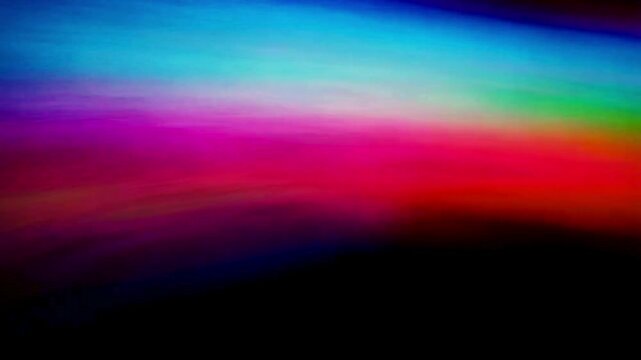 abstract clowing background with multicolored blurred gradients moving on dark
