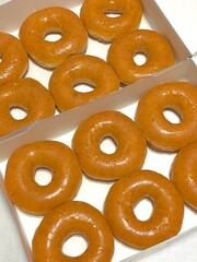 A classic glazed donut with a soft, fluffy texture and a sweet, glossy coating. Perfectly balanced between light and sugary, making it an irresistible treat for any time of the day.
