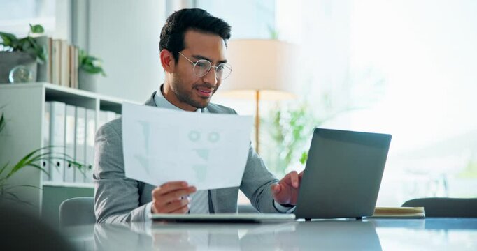 Happy, asian and businessman with laptop or documents for accounting, budget planning or corporate finance at office. Man, accountant or employee with smile on computer for company expenses or profit