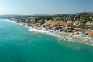 Fototapeta premium Aerial view of the tropical San Clemente coastline showcasing pristine beaches and lush landscape