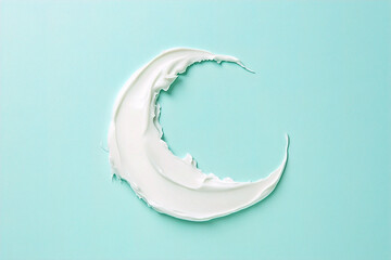 White-coloured, smooth moisturizer swooshs in a crescent shape on a solid colour background. (Generative AI) 
