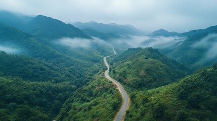 Green valley with winding roads and mountains