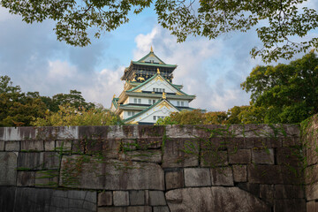Osaka Castle on the background of the fortress wall on a sunny autumn morning, Osaka, Japan