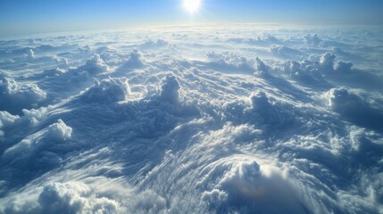 Aerial View of White Clouds with Sun Glowing Through