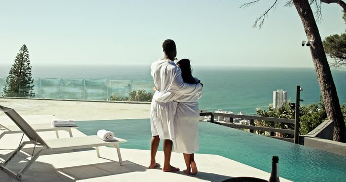 Champagne, pool and couple cheers at hotel for anniversary, honeymoon and vacation. Hospitality, love and man and woman embrace, hug and toast with alcohol for romance on holiday, travel and weekend