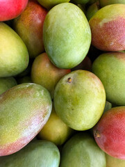 Fresh mangoes displayed at market stand