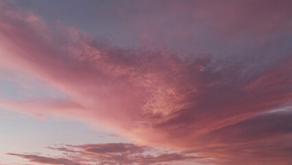 Stunning dreamy sky scene with vibrant pinky clouds. Beautiful nature background for girly wallpaper, header and banner.