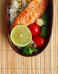 A traditional Korean dosirak, beautifully arranged with rice, assorted banchan, and savory proteins. Balanced and visually inviting, it’s a portable meal packed with vibrant flavors.
