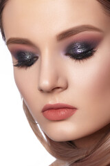 Fototapeta premium Beautiful Woman with an Fashion Hairstyle and Creative Makeup. Beauty face with trendy Make-up