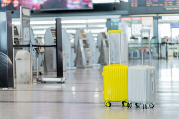 Two suitcases in an empty airport hall, traveler cases in the departure airport terminal waiting for the area, vacation concept, blank space for text message or design, luggage for travel vacation.