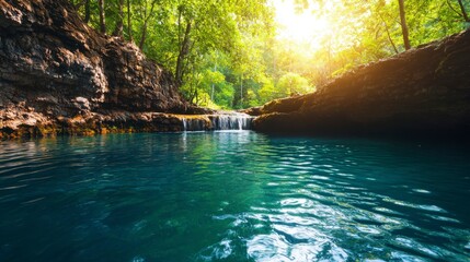 Naklejka premium Serene Natural Oasis with Crystal Clear Water and Cascading Waterfall Surrounded by Lush Green Forest and Sunlight Filtering Through Trees